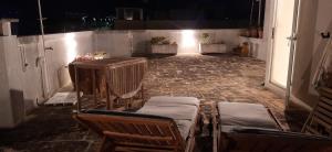 A seating area at Villa Bianca, Seaside panoramic Rooftop