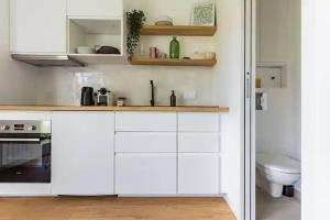Η κουζίνα ή μικρή κουζίνα στο Charmant appartement calme proche de Paris +26 φωτογραφίες