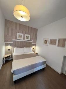 Postel nebo postele na pokoji v ubytování Hotel La Pace