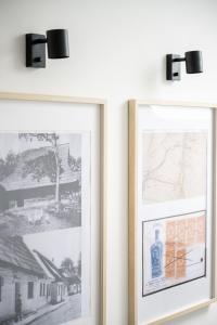 two framed pictures of a bottle of wine on a wall at MiLove in Milówka +146 photos