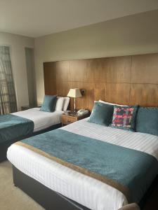 Voodi või voodid majutusasutuse Cryans Hotel toas