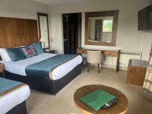 Voodi või voodid majutusasutuse Cryans Hotel toas