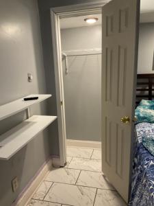 a room with a closet and a bed and a door at Cozy Fleure place in Lawrenceville +8 photos