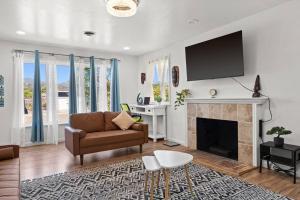 a living room with a couch and a fireplace at The Cozy Haven Retreat in Novato