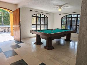 a pool table in the middle of a room at CasonaPalmira in Cuernavaca