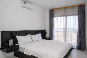 Voodi või voodid majutusasutuse Manta Surf Hotel toas
