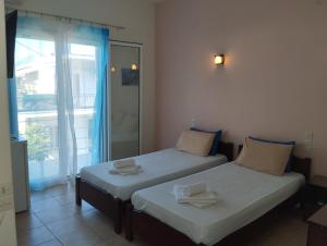 Postel nebo postele na pokoji v ubytování Hotel Neon Astron
