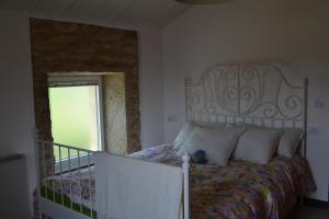 מיטה או מיטות בחדר ב-Casa de Moreira