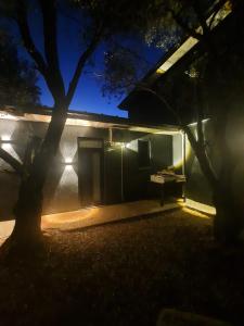 a house with lights on the side of it at night at Aze's Garden suites - Kalkan, Kaş in Kaş