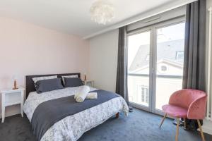Ένα ή περισσότερα κρεβάτια σε δωμάτιο στο Appartement Hyper Centre Parking Privée