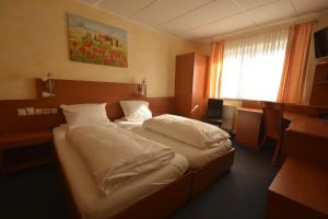 Postel nebo postele na pokoji v ubytování Hotel Nord
