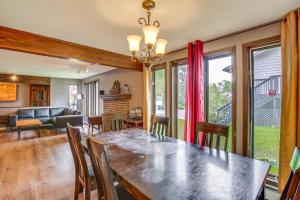 a dining room and living room with a table and chairs at Near Downtown and Fishing Anchorage Escape! in Anchorage