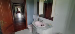 a bathroom with a sink and a mirror at La Sierra del Aguanaz in Entrambasaguas +29 photos