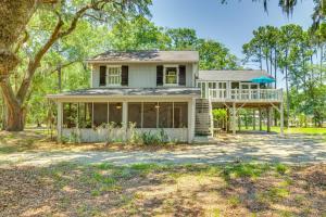 a house with a wrap around porch and a deck at Near Edisto Beach State Park Home with Lanais! in Edisto Island