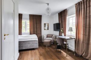 Postel nebo postele na pokoji v ubytování Söderfors Herrgård + 37 fotografií