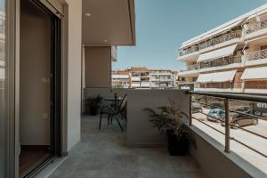 an apartment balcony with a view of a city at Dantis Place Alpha1 in Nafplio
