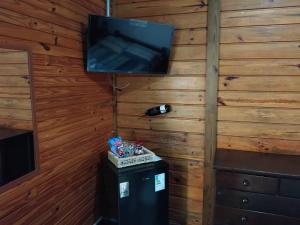 Et tv og/eller underholdning på Pousada Florada na Serra - Apto 6