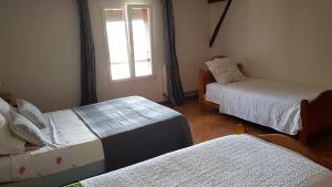 Postel nebo postele na pokoji v ubytování La Sente des Vignes