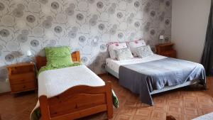 Postel nebo postele na pokoji v ubytování La Sente des Vignes