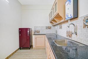 Kuchyň nebo kuchyňský kout v ubytování Ruby Hotel Apartments