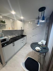 Køkken eller tekøkken på Алиханова 10А