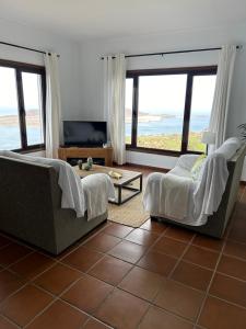 a living room with a view of the ocean at Casa Vereda del Risco in Ye