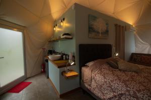 Postel nebo postele na pokoji v ubytování Pura Vista Glamping