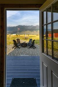 a view from the door of a porch with chairs at Blackhawks Nest in Livingston