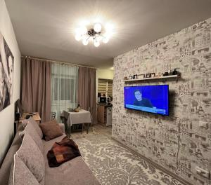 A television and/or entertainment centre at Tiny Paradise near Prisma