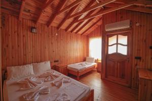 Postel nebo postele na pokoji v ubytování YAVUZ MOTEL ADRASAN