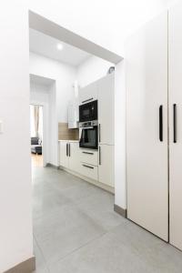 Kuchyň nebo kuchyňský kout v ubytování Charmantes Altbau-Apartment nahe Donaukanal Zentrumsnah mit Küche & WLAN + 8 fotografií