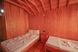 Postel nebo postele na pokoji v ubytování YAVUZ MOTEL ADRASAN