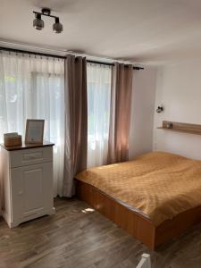 Posteľ alebo postele v izbe v ubytovaní JAndi apartman