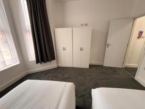 Ένα ή περισσότερα κρεβάτια σε δωμάτιο στο L&C Apartments