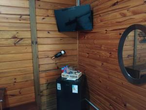 Et tv og/eller underholdning på Pousada Florada na Serra - Apto 9