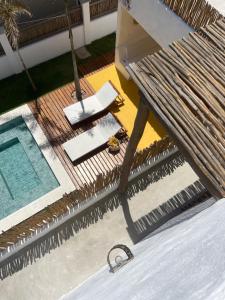 an overhead view of a hammock next to a pool at Casamaré Guajiru in Trairi