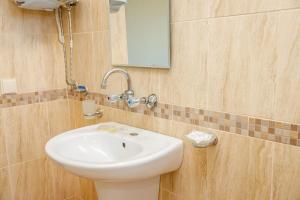 a bathroom with a white sink and a mirror at Family Hotel Silitur in Ahtopol +46 photos