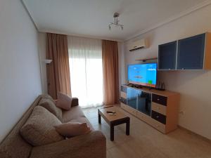 TV a/nebo společenská místnost v ubytování Torremar 34