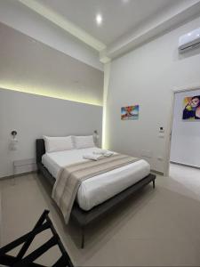 Cama o camas de una habitación en Dimora Chiaia 209