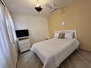 Postel nebo postele na pokoji v ubytování Hotel Coco de Mar Quinta Avenida + 40 fotografií