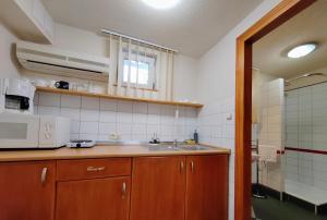 A kitchen or kitchenette at Hévíz Apartman Hévíz
