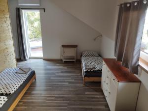 Posteľ alebo postele v izbe v ubytovaní Apartmány Svatá