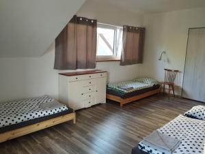 Posteľ alebo postele v izbe v ubytovaní Apartmány Svatá