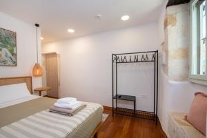 En eller flere senge i et værelse på Casa Elysium - Chania Old City