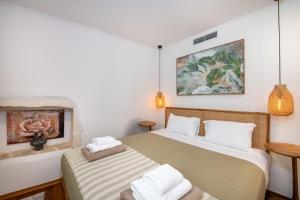 En eller flere senge i et værelse på Casa Elysium - Chania Old City