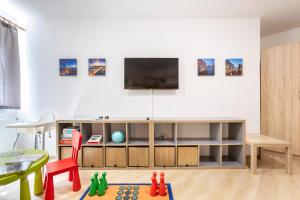 TV a/nebo společenská místnost v ubytování Apartmán "U nás doma" v chatě ALFA Černý Důl