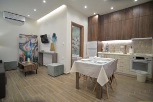 a kitchen with a table with a white table cloth on it at Casa Nostra in Litochoro