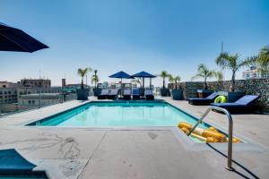 a swimming pool on top of a building at Downtown Los Angeles Condo with Rooftop Pool Access in Los Angeles