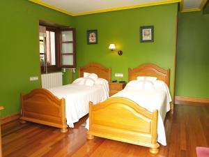 Postel nebo postele na pokoji v ubytování Hostal Rural Onbordi