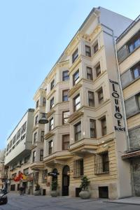 a large white building with a sign on it at Taxim Lounge Hotel Special Category in Istanbul